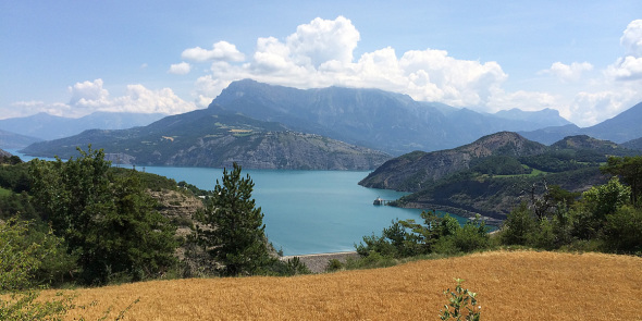 Panoramic view on the lake of Serre-Ponçon, its dam and the Muséoscope